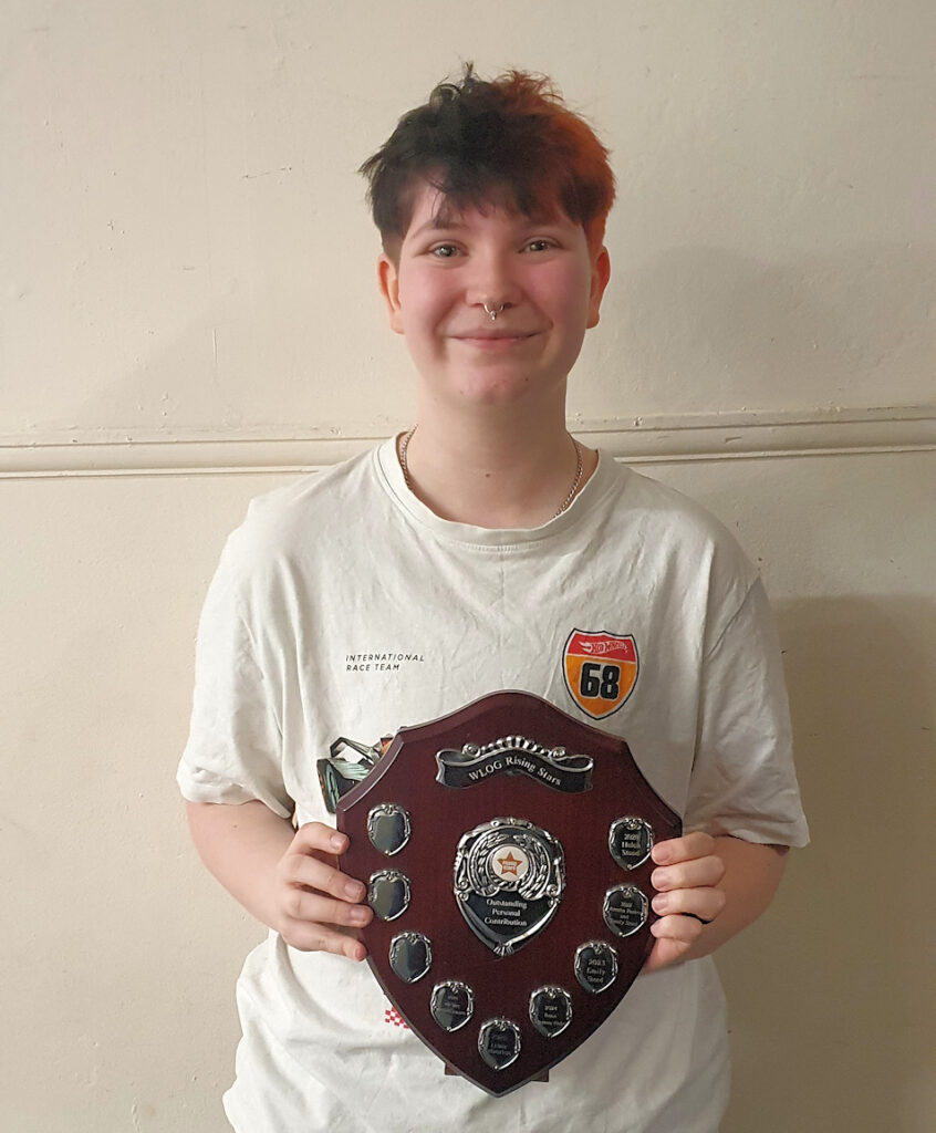 Pip with their award shield for Outstanding Personal Contribution