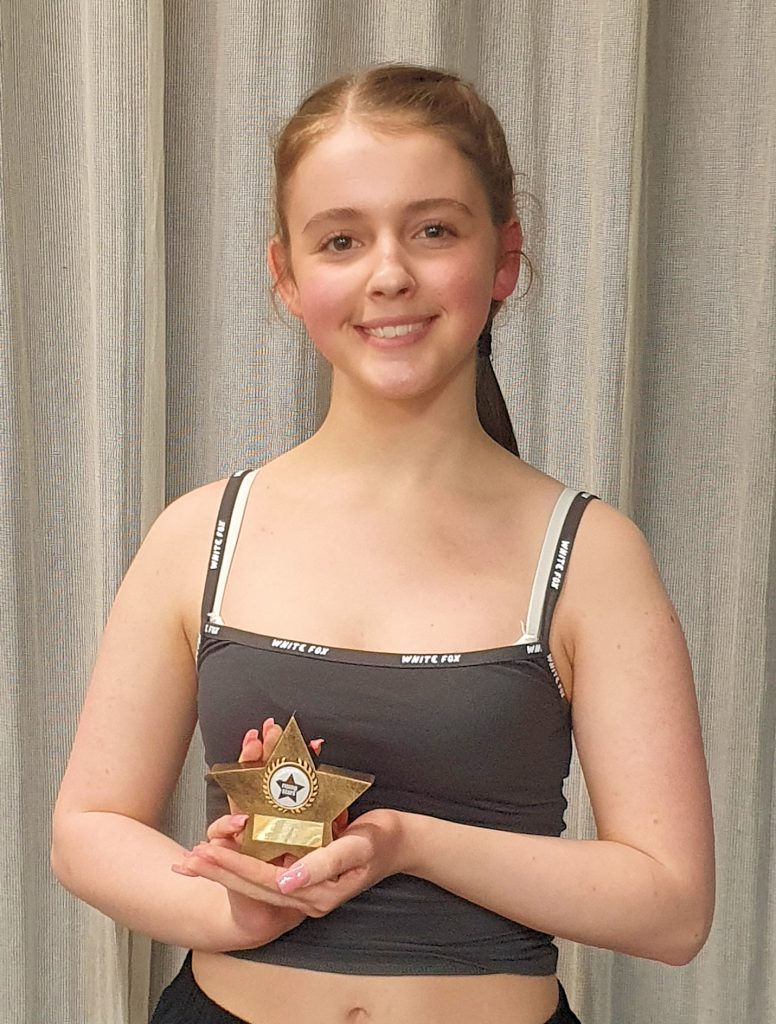 Tess with her Rising Stars Long Service Award for 10 productions.